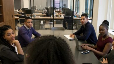 a group of people sitting around a table